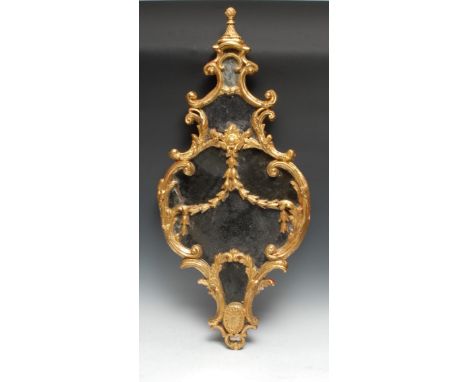 A mid-18th century giltwood and gesso cartouche shaped looking glass, knop finial, bordered and applied with leafy C-scrolls 