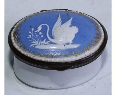 A George III South Staffordshire enamel oval patch box, hinged cover decorated in raised opaque with a swan, on a pale blue g