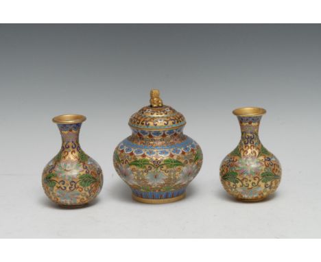A Chinese cloisonné enamel garniture, of small proportions, comprising an ogee-shaped jar and cover and a pair of baluster va