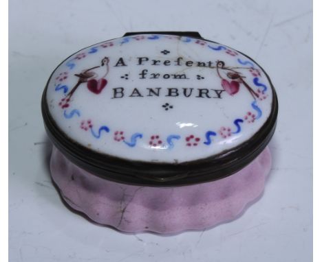 A George III South Staffordshire enamel oval patch box, the hinged cover inscribed A Present from Banbury and painted with lo