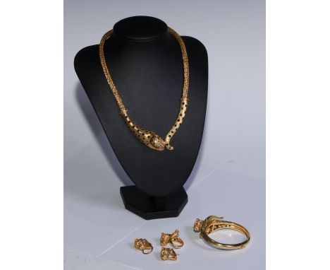 An 18ct gold leopard parure, each element set with sapphires and diamonds accented with ruby eyes, comprising necklace, hinge