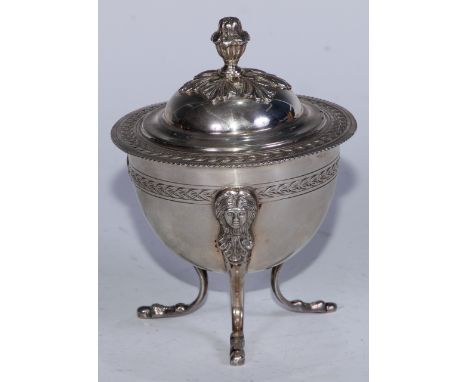 An Italian Neo-Classical silver tripod sugar box, domed cover with bud finial, serpentine legs with masks to knees, 13cm high