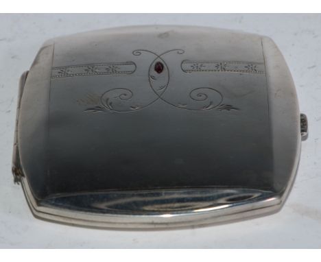 An early 20th century Continental silver rounded rectangular cigarette case, hinged cover engraved and set with a ruby, 10cm 