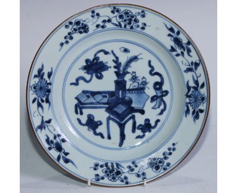 A Chinese plate, painted in tones of underglaze blue with precious objects, 22.5cm diam, Kangxi, early 18th century 