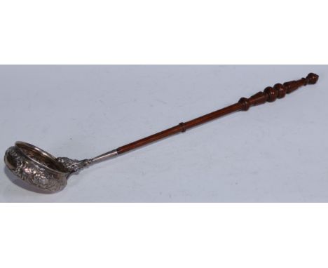 A William IV/early Victorian Scottish silver punch ladle, the bowl chased with stiff leaves, flowers and scrolling foliage, t