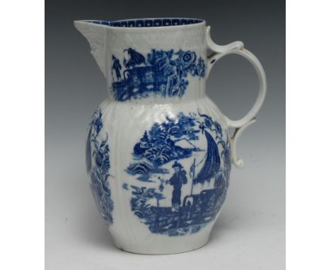A large Caughley Cormorant pattern cabbage leaf moulded mask jug,  printed in underglaze blue with fisherman in a landscape, 