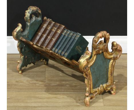An imposing Italian Rococo Revival parcel-gilt polychrome painted softwood and gesso book trough, cartouche shaped end suppor