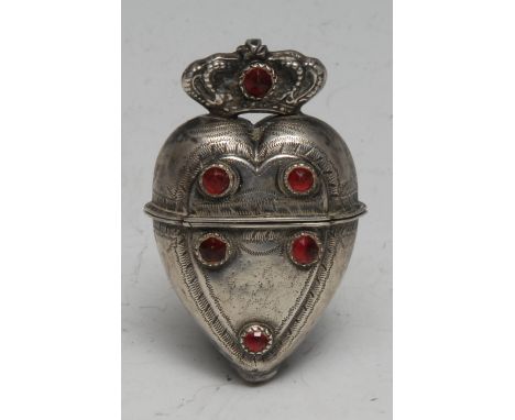 A 19th century South European silver nutmeg grater, as a crowned heart, the hinged cover enclosing a rasp, the wrigglework ca