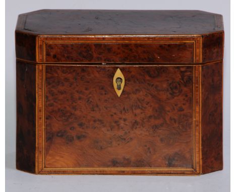 A George III canted rectangular yew wood tea caddy, the hinged cover and front outlined with tulipwood cross banding, boxwood