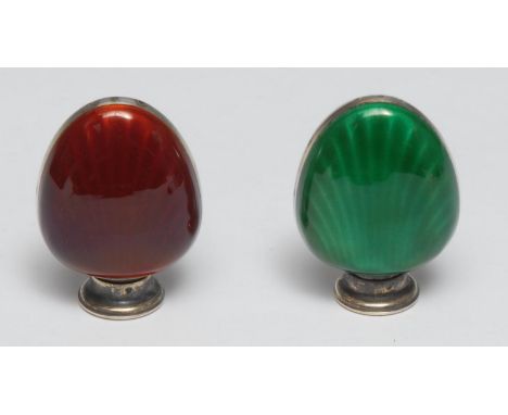 A pair of Scandinavian silver and enamel shell shaped peppers, decorated in tones of green and red, 5cm high 