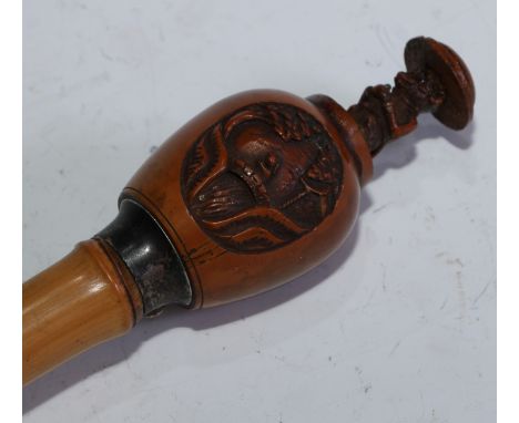 A 19th century Chinese novelty automaton walking stick, the gourd pommel carved with landscape panels and enclosing a sprung 