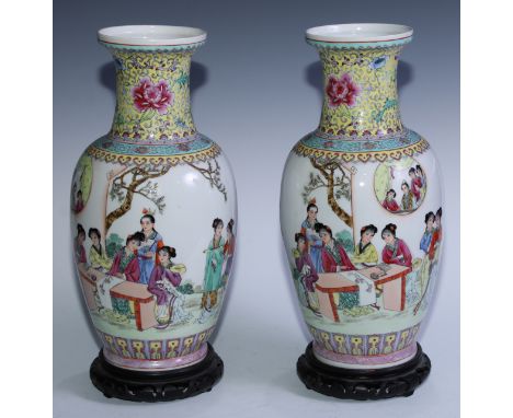 A pair of Chinese ovoid vases, painted in polychrome with ladies painting scrolls, 36cm high, red seal marks, 20th century 