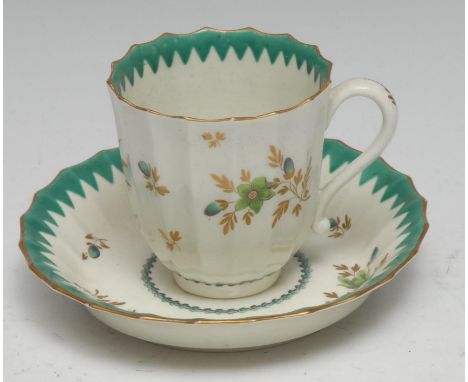 A Worcester chocolate cup or large coffee cup, of faceted form, decorated with stylised foliage,  green sawtooth border, c.17