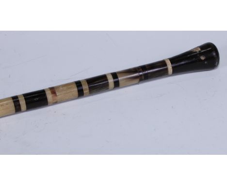 A 19th century Colonial horn walking stick, the cane composed of banded specimens, 91cm long 