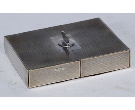 An Art Deco silver playing card box, with two drawer compartments, engine turned overall, 13.5cm long, marked patent applied 