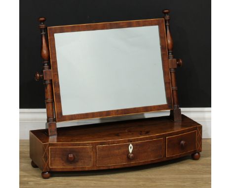 A 19th century mahogany dressing mirror, rectangular plate, ring-turned supports, bow-centre base with three frieze drawers, 
