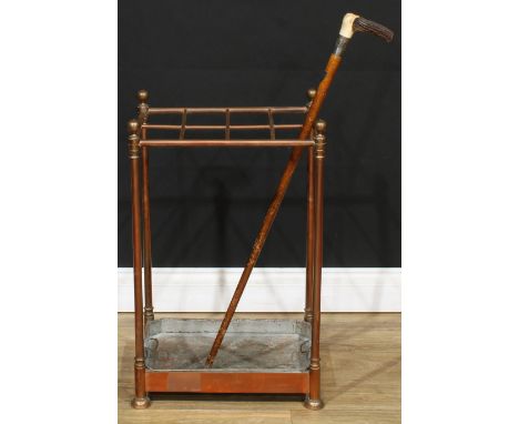 A Victorian brass and copper eight-section country house walking stick stand, with umbrella and cane provision arranged in tw