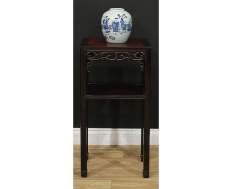 A Chinese hardwood two-tier jardinière stand, rectangular panel top, shaped and pierced apron carved with scrolls, open under