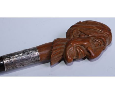 Judaica - an early 20th century walking stick, the pommel carved as the head of a Jewish man, coromandel cane, 87cm long, the