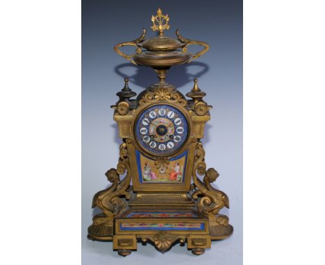 A 19th century French gilt metal porcelain mounted mantel clock, 9.5cm circular porcelain dial with Roman numerals on a bleu 