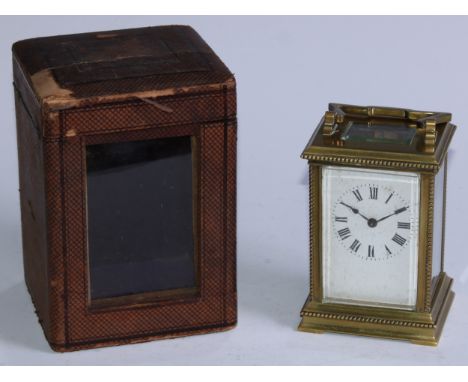 An early 20th century lacquered brass carriage timepiece, 5.5cm rectangular enamel clock dial inscribed with Roman numerals, 