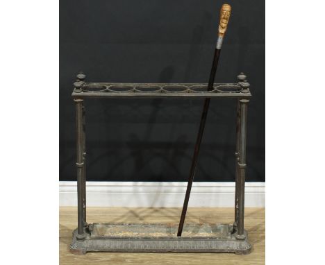 A Victorian cast iron walking stick or umbrella stand, in the manner of Coalbrookdale, rectangular top with six circular divi