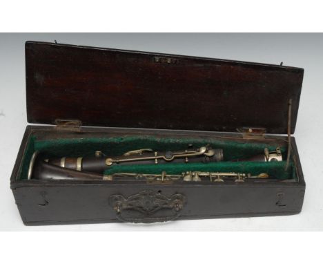 A 19th century EPNS-mounted rosewood four-section clarinet, 65cm long, green baize-lined mahogany tapering rectangular case e