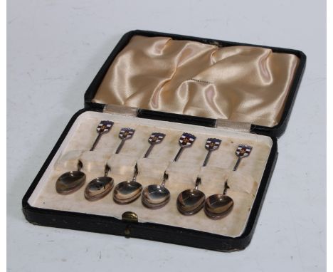 A set of six Elizabeth II silver and enamel coffee spoons, the terminals decorated with the arms of Lincoln, Deakin &amp; Fra