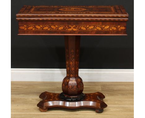 A 19th century Irish Killarney marquetry and yew games table, hinged rectangular top inlaid with an oval reserve of Muckross 