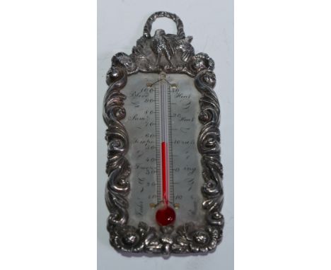 A George IV silver travelling thermometer, the flowerhead and leafy scroll border crested by birds and a suspension ring, mot