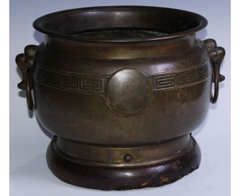 A large Chinese bronze censer, everted rim above a band of trellis centred by script character roundels, ring handles to side