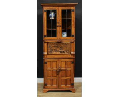 Tom Spencer, 'Nailman of Belper' - a 'Monastic Woodcraft' oak floor-standing corner display cabinet, moulded cornice above a 