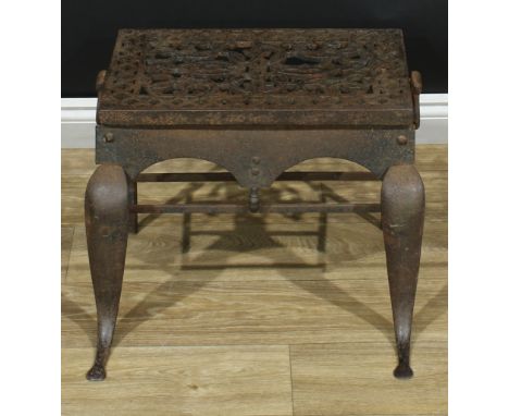 A George III steel and cast iron footman, pierced rectangular plateau above a shaped apron with acorn under-finial, cabriole 