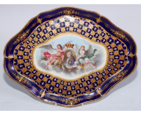 A Sevres lobed navette shaped cabinet tray, painted to centre with an oval crowned portrait of Louis XVI, flanked by angels a