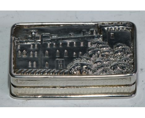 An early Victorian silver rounded rectangular castle top vinaigrette, hinged cover with a view of Warwick Castle, gilt interi