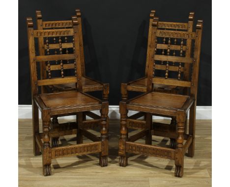 A set of four oak dining chairs, by Nigel Griffiths, signed, each with a nulled rectangular cresting rail, ladder-back divide