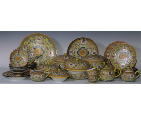 A Chinese dinner and tea service, comprising teapot, milk jug, cups, saucers, tureens , plates and dishes, each decorated in 