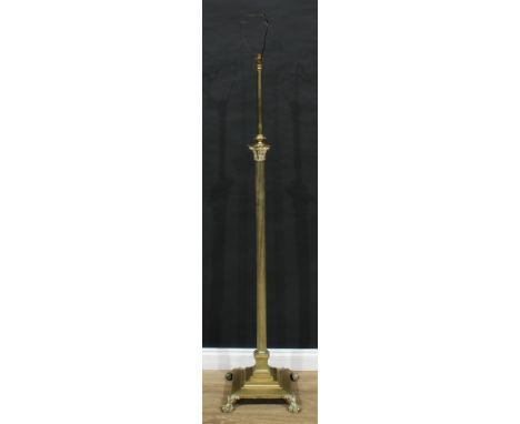 An early 20th century brass Corinthian column telescopic standard lamp, fluted pillar, stepped square base, lion paw feet, 14