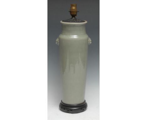 A Chinese pale celadon tapering cylinder vase, lion mask terminals, later fitted for electricity as a table-lamp, hardwood st