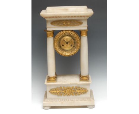 A French Empire ormolu and alabaster portico mantel time piece, 14cm circular dial embossed with flowering stems and engine t
