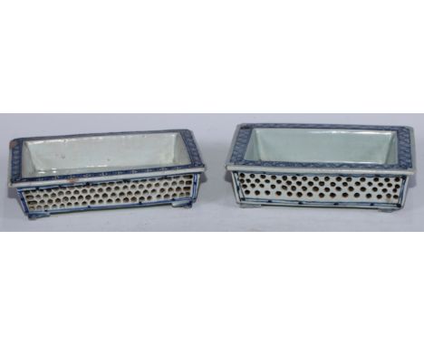 A Chinese rectangular flower trough, everted rim above reticulated sides, decorated in underglaze blue with trellis, shallow 
