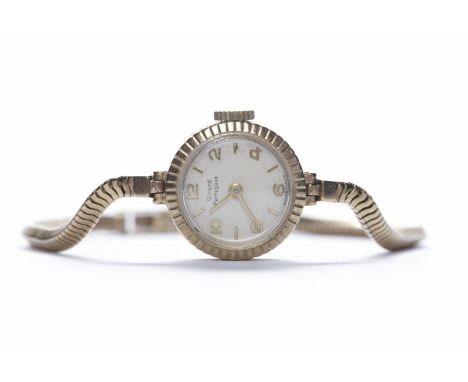LADY'S GIRARD PERREGAUX NINE CARAT GOLD MANUAL WIND COCKTAIL WATCHthe round white dial with applied Arabic numerals and baton