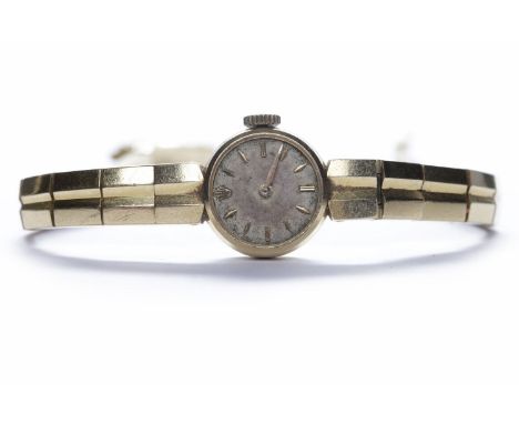 LADY'S ROLEX EIGHTEEN CARAT GOLD MANUAL WIND COCKTAIL WATCHthe round dial with applied gold coloured baton numerals, Rolex cr