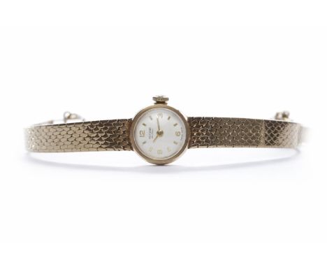 LADY'S ROTARY NINE CARAT GOLD MANUAL WIND WRIST WATCHthe round white dial with Arabic numerals and wedge hour markers, 17mm c