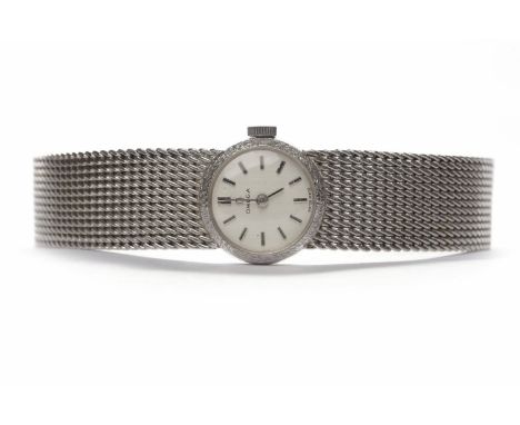 LADY'S OMEGA NINE CARAT WHITE GOLD MANUAL WIND WRIST WATCHthe round silvered dial with baton hour markers, the 16mm case on a