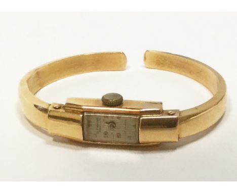 LADY'S STRONO GENEVE EIGHTEEN CARAT GOLD 17 JEWELS WRIST WATCHthe movement signed CANOE WATCH CO, the rectangular dial with o