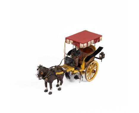 A model 'Paris Chaise gig', yellow and black painted with canopy and fully harnessed horse complete with lamps and whip, 20cm