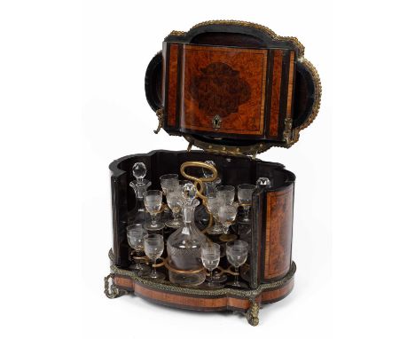 A French burr walnut and inlaid table top drinks cabinet, 19th Century, gilt metal mounts, oval shaped the hinged cover and f