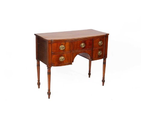 An American Regency style mahogany sideboard by Leo A Ziske the bowfront top above a central frieze drawer flanked to the lef