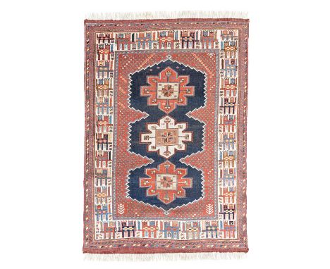 An Afshar rug, South West Persia, first quarter 20th Century, the madder field of frogspawn motifs with an indigo reserve con